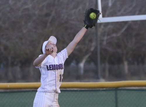 Lemoore's Katelyn Cole came up with this seventh inning catch to help preserve Lemoore's West Yosemite League opener.